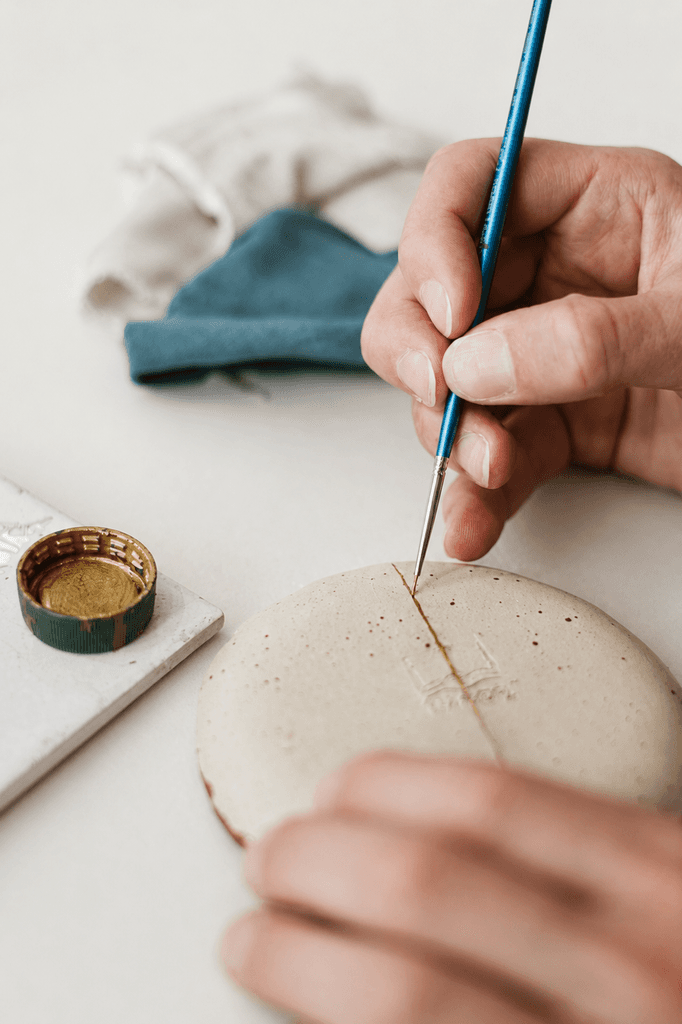 A hand stitching an embroidery hoop, a visual reference for a Soft Signals widget.